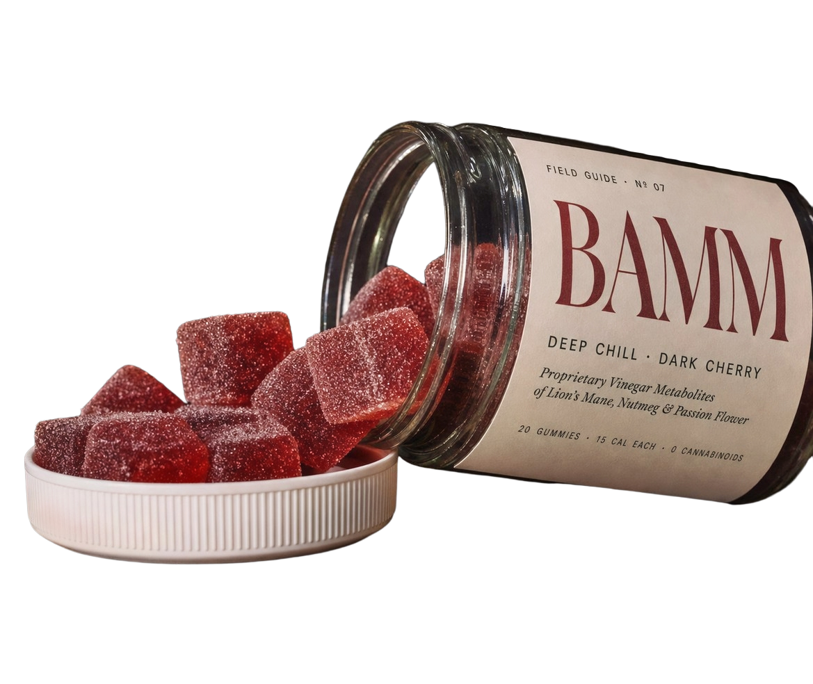 BAMM Deep Chill — dark cherry gummies spilling from a glass jar with cream Field Guide No. 07 label