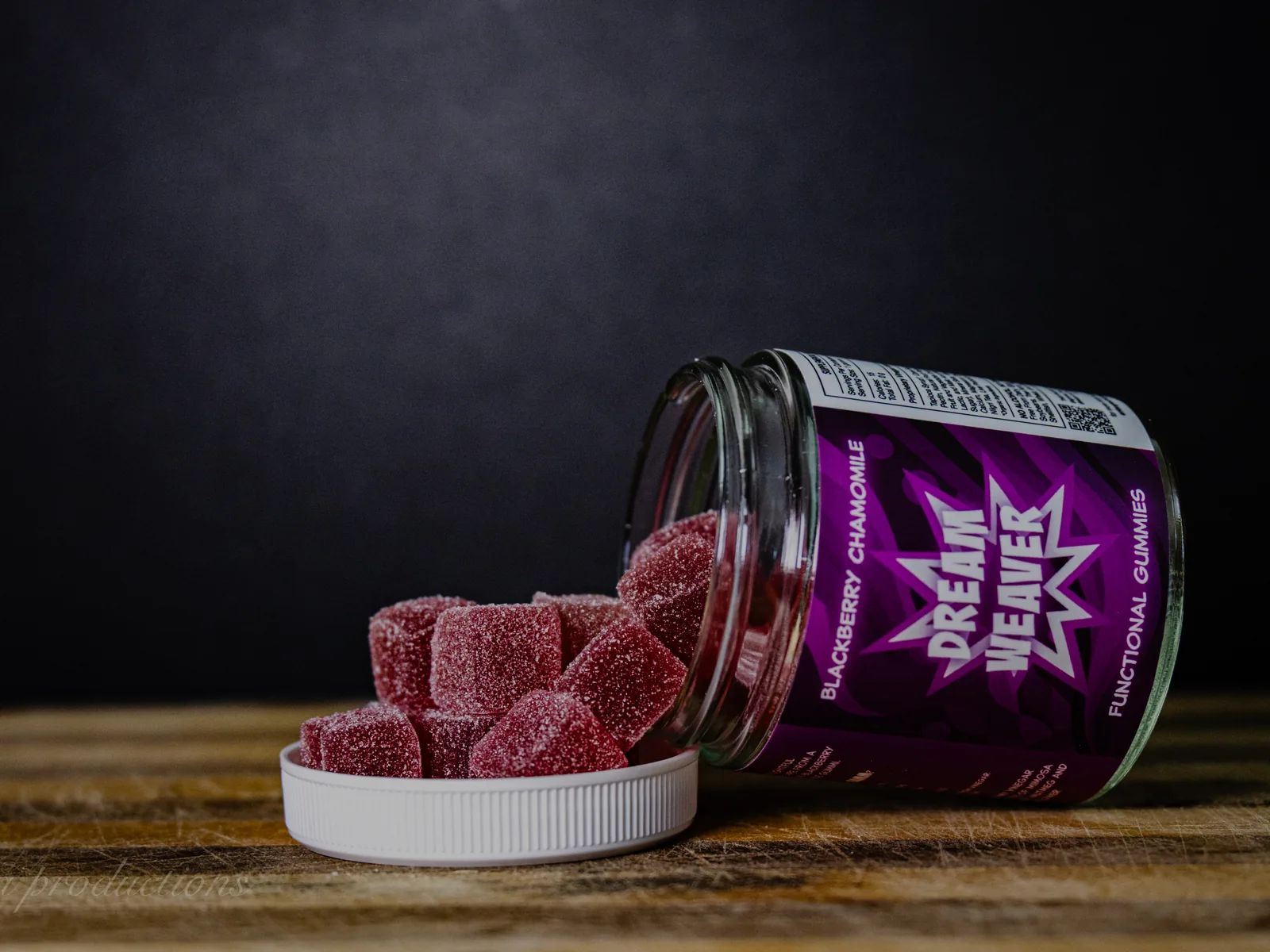 BAMM Dream Weaver glass jar with blackberry chamomile gummies on a dark studio backdrop.